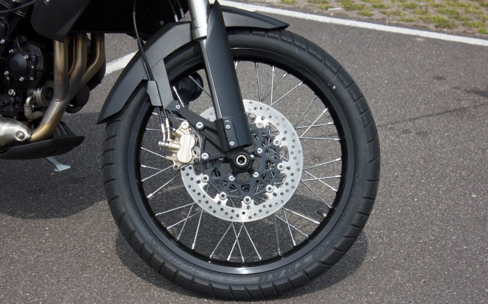 The 21" spoked front wheel ruins handling and brakes