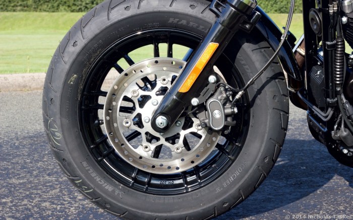 2015 model finally gets cast wheels as standard, losing weight. Weak brakes remain.